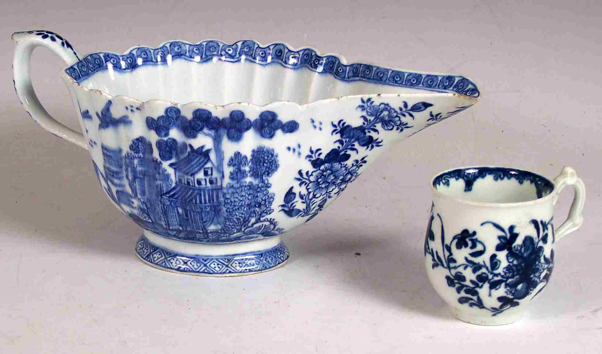 A large 18th century English porcelain blue printed sauce boat,