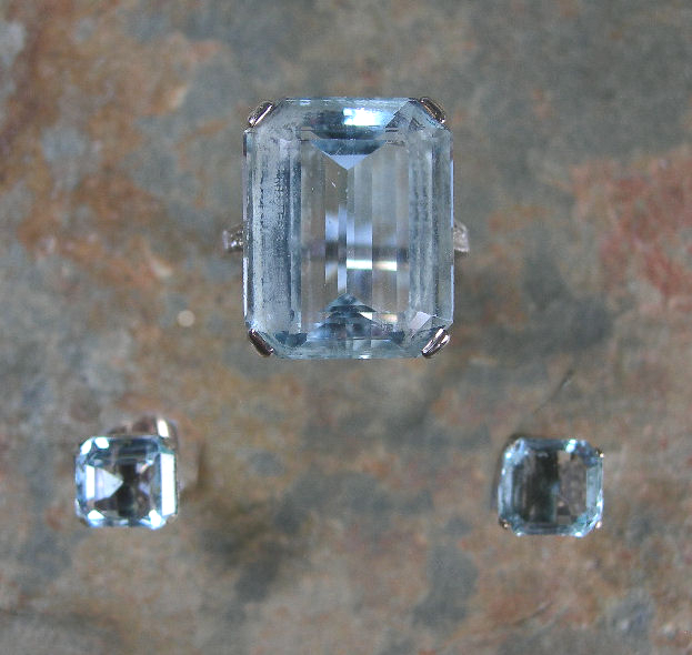An aquamarine and diamond set cocktail ring and matching earrings,