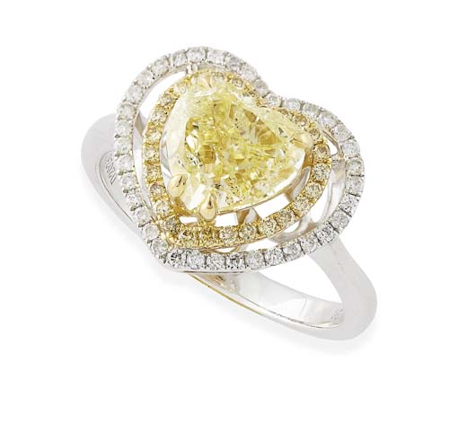 A heart cut fancy yellow and colourless diamond set cluster ring