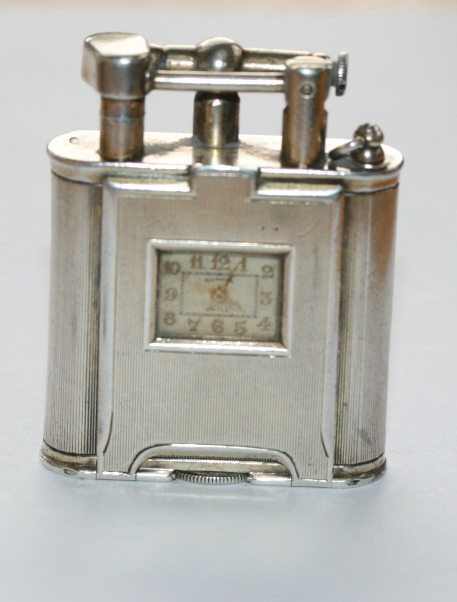 Alfred Dunhill - a silver cased cigarette lighter with integral watch