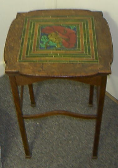 An Arts and Crafts oak occasional table