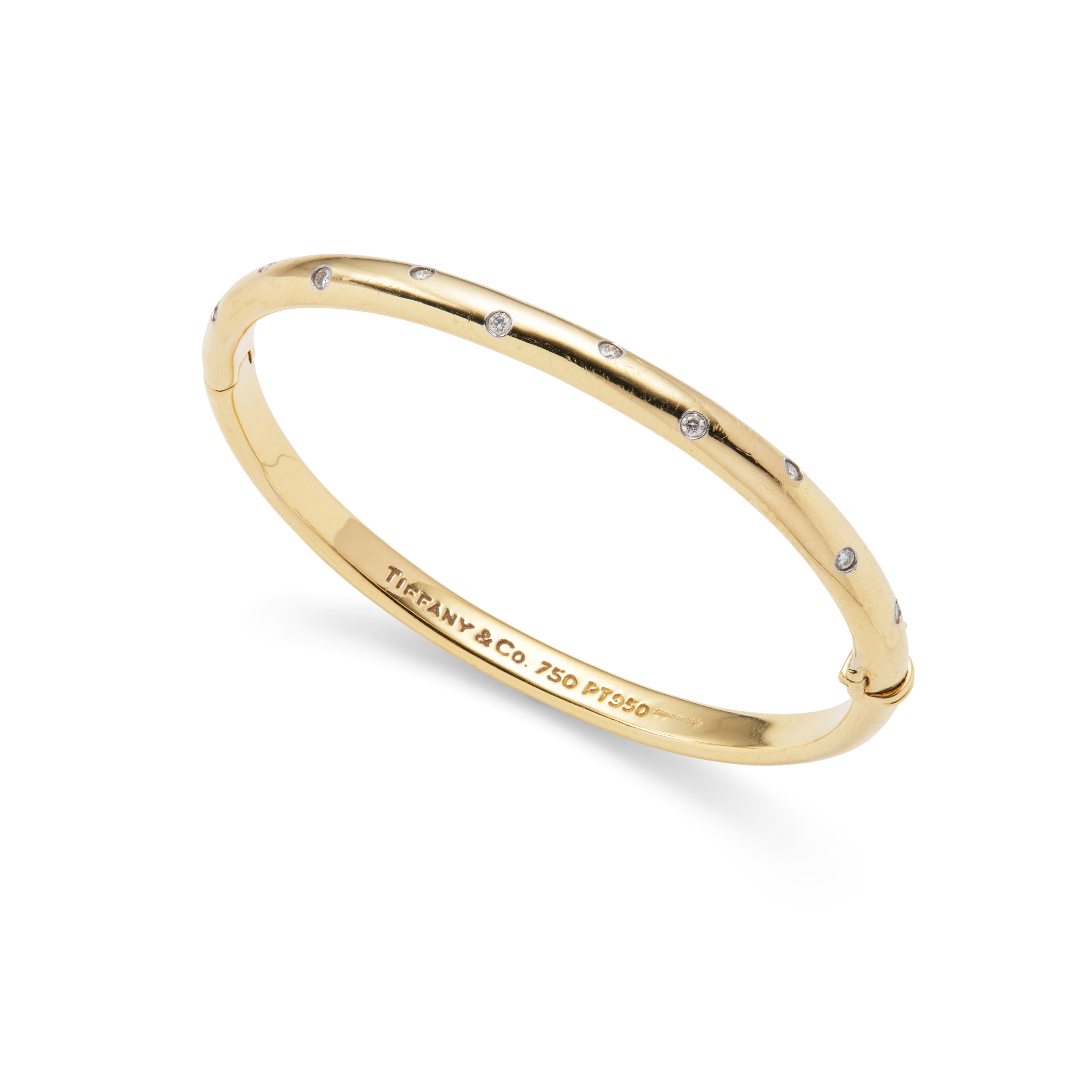 Tiffany & Co.: A gold and diamond 'Etoile' bangle, 1999