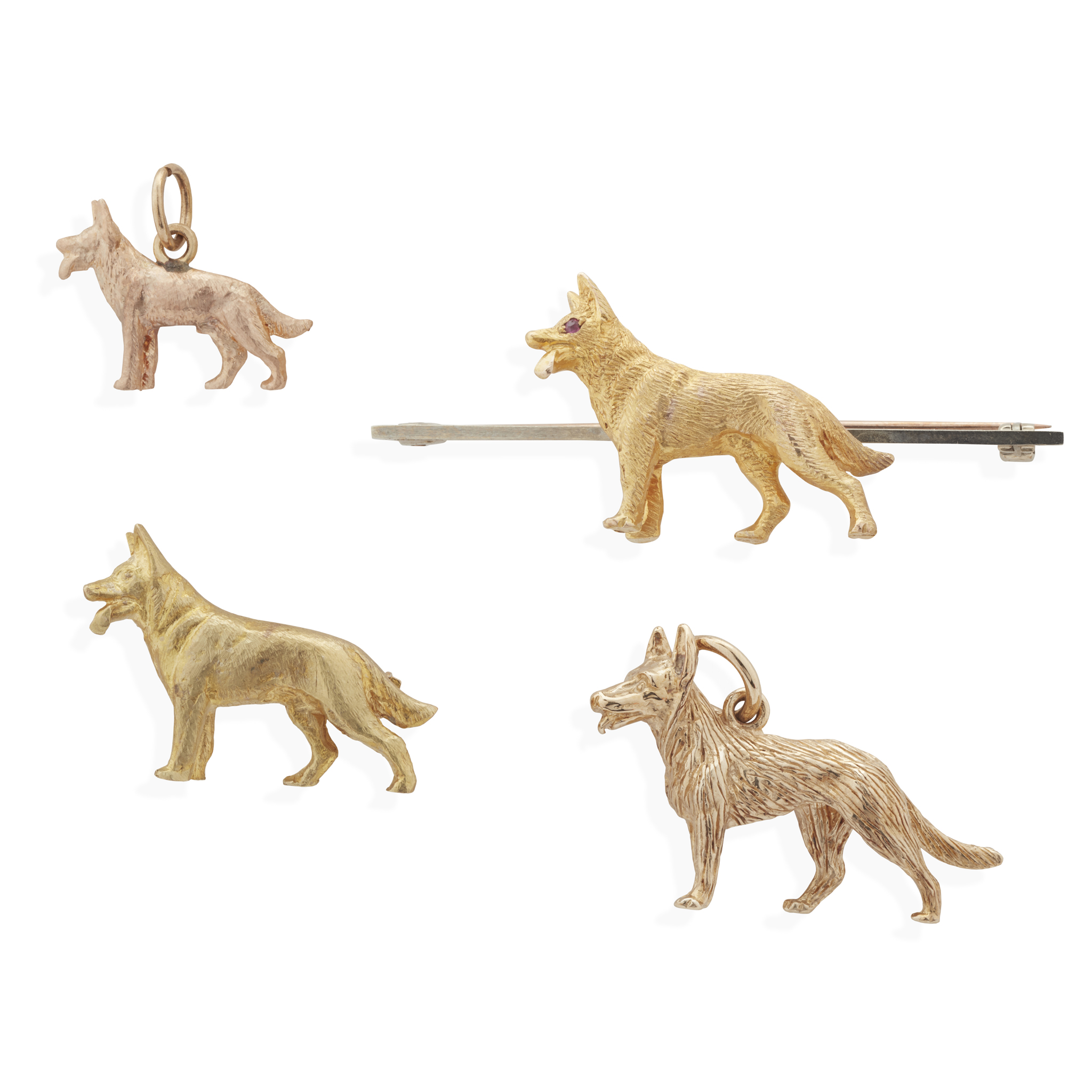 A collection of 'German Shepherd' pendants/brooches