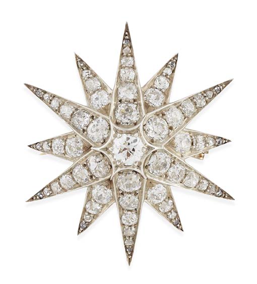 A late Victorian style diamond set star form brooch/pendant