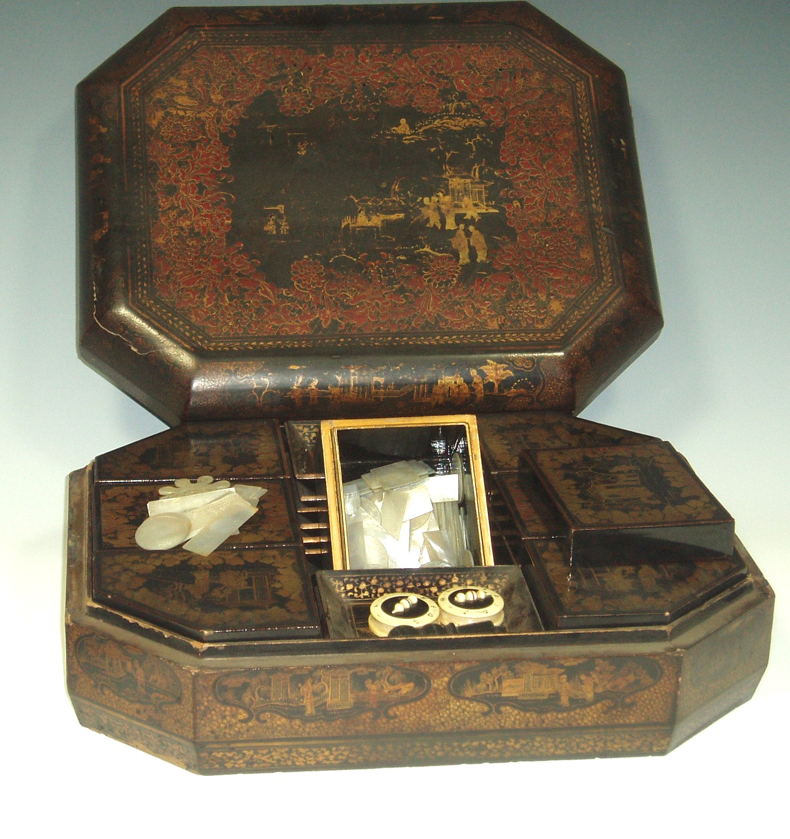 An oriental lacquered and gilt work box,