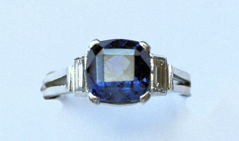 An Art Deco platinum mounted sapphire and diamond set ring