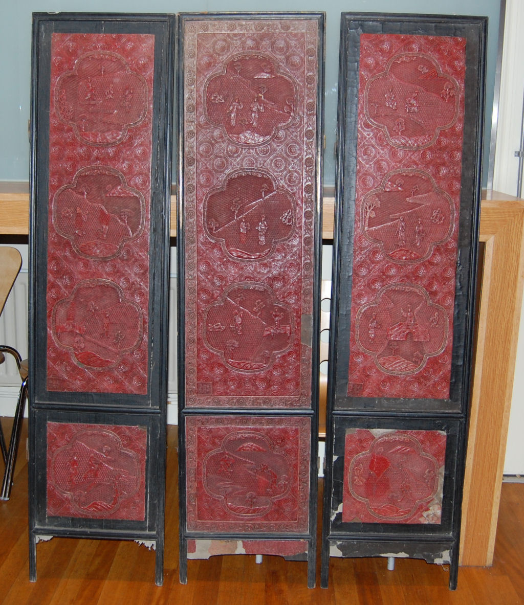 A Chinese cinnabar lacquer three fold screen