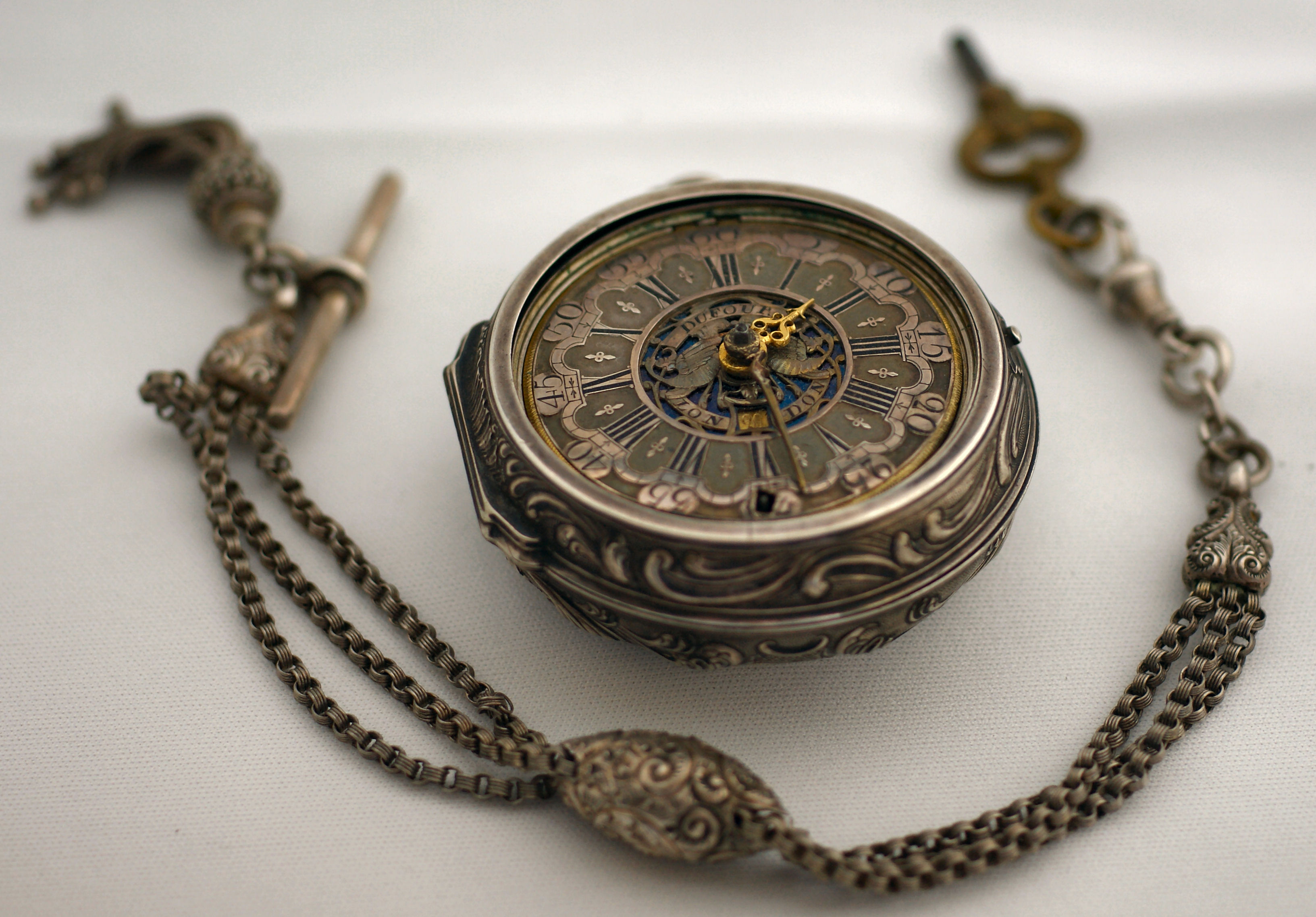 A good silver and enamel pair cased verge pocket watch