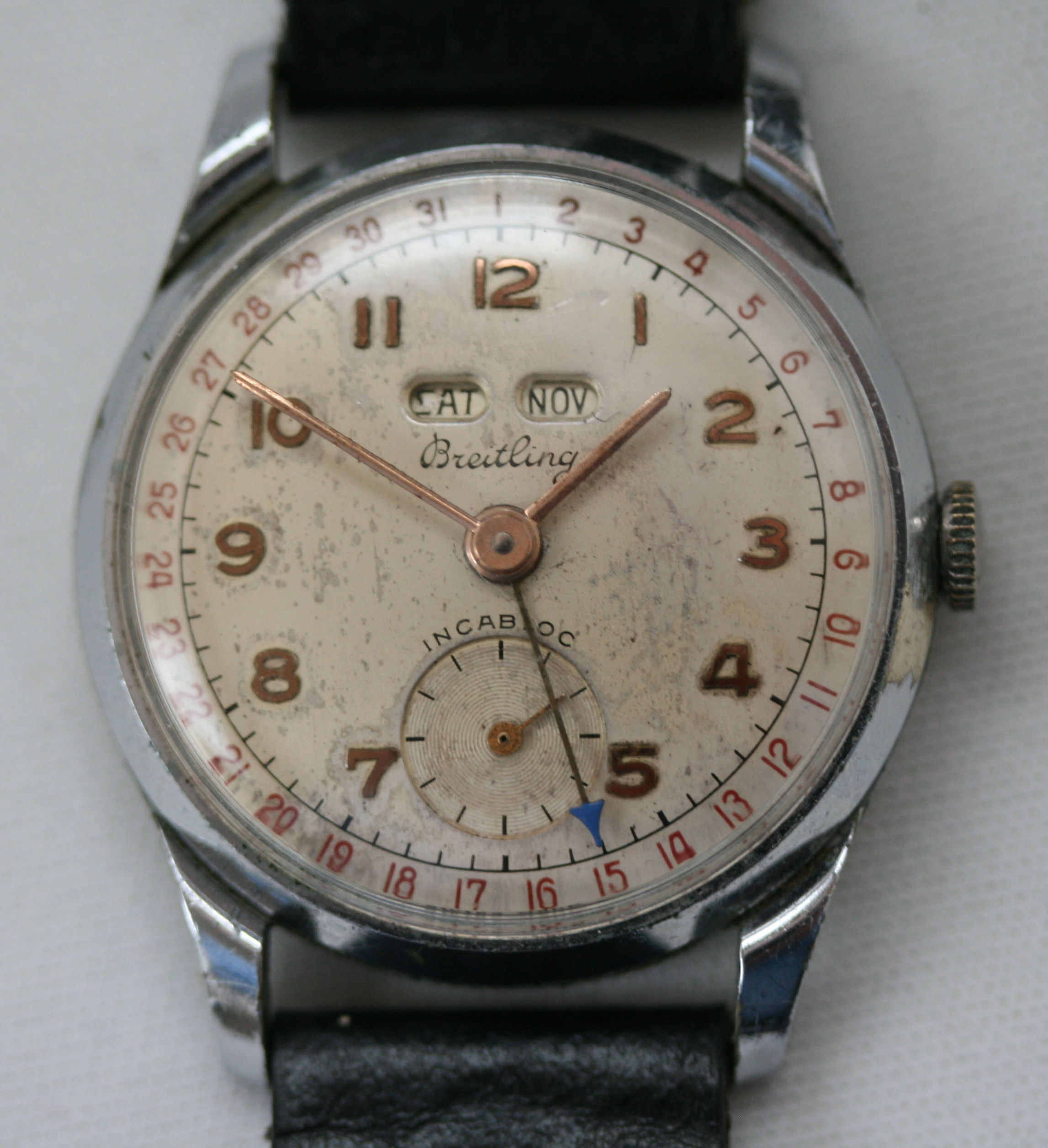 BREITLING - a gent's wrist watch with day, date, month