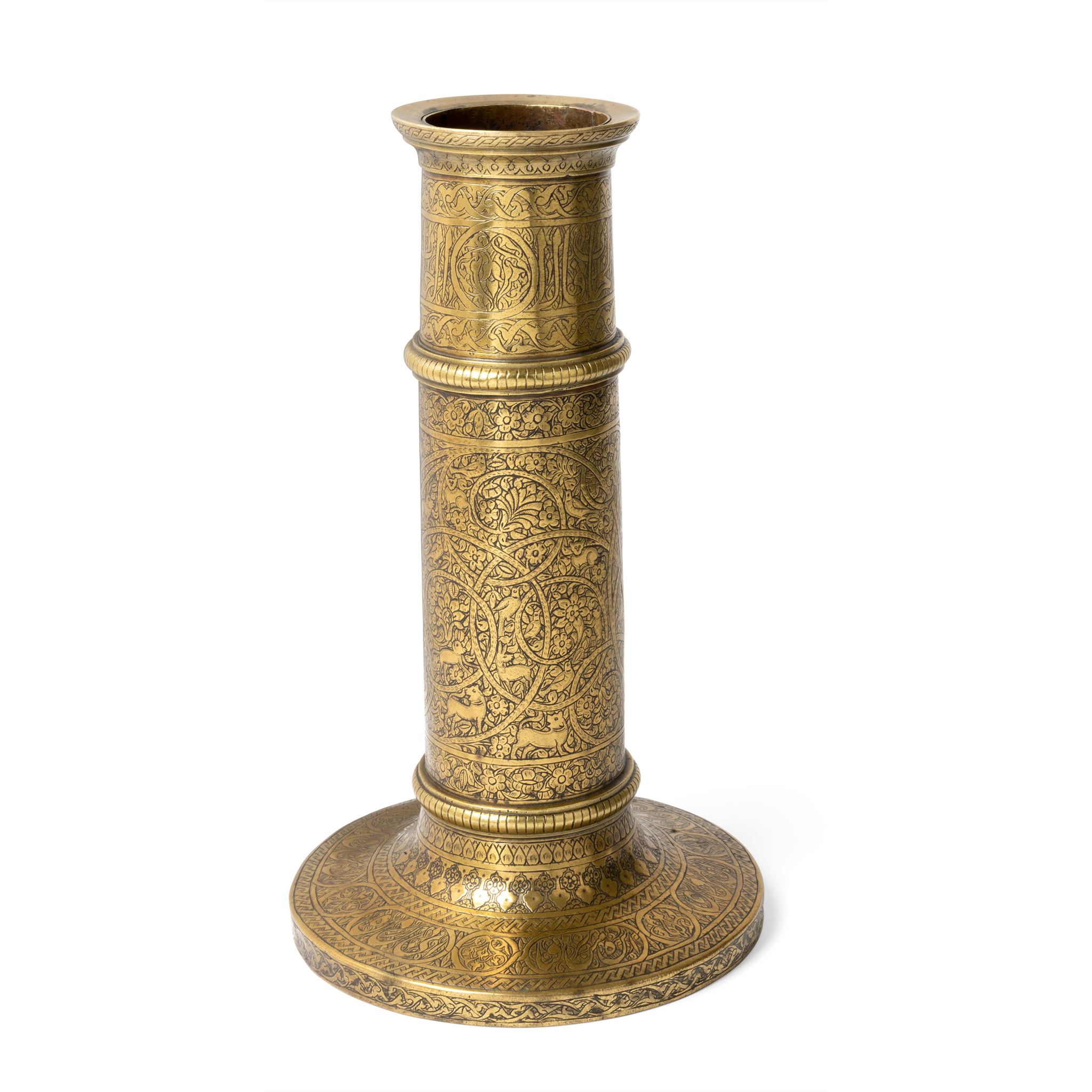 A QAJAR ENGRAVED BRASS CANDLESTICK