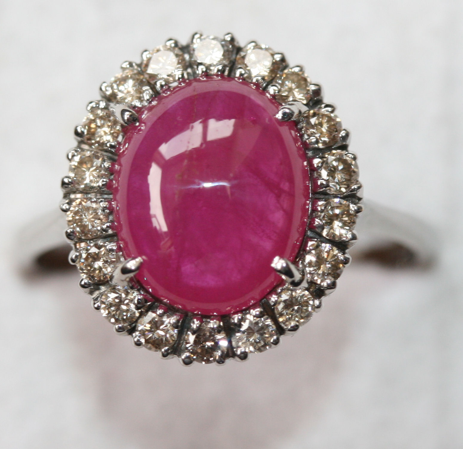 A contemporary 14ct white gold mounted ruby and diamond cluster ring