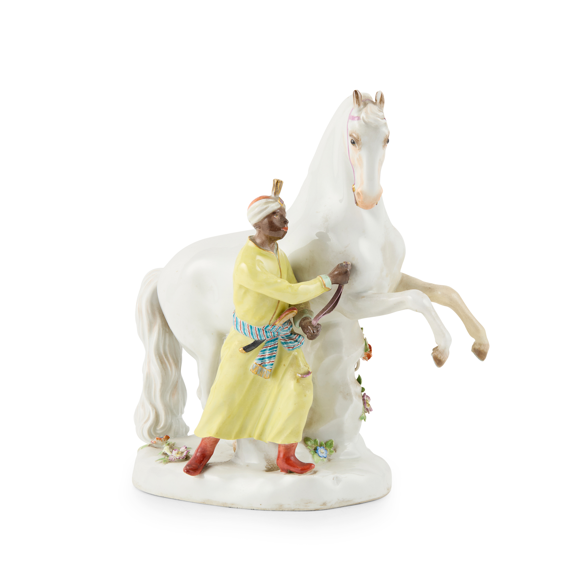 MEISSEN FIGURE OF A BLACKAMOOR GROOM LEADING A HORSE