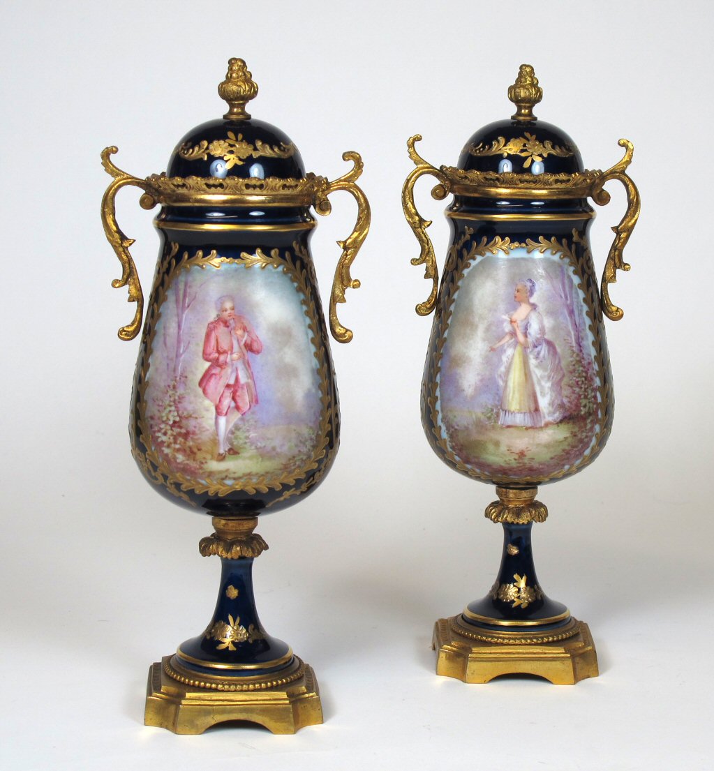 A pair of late 19th/ early 20th century Sèvres style vases and covers