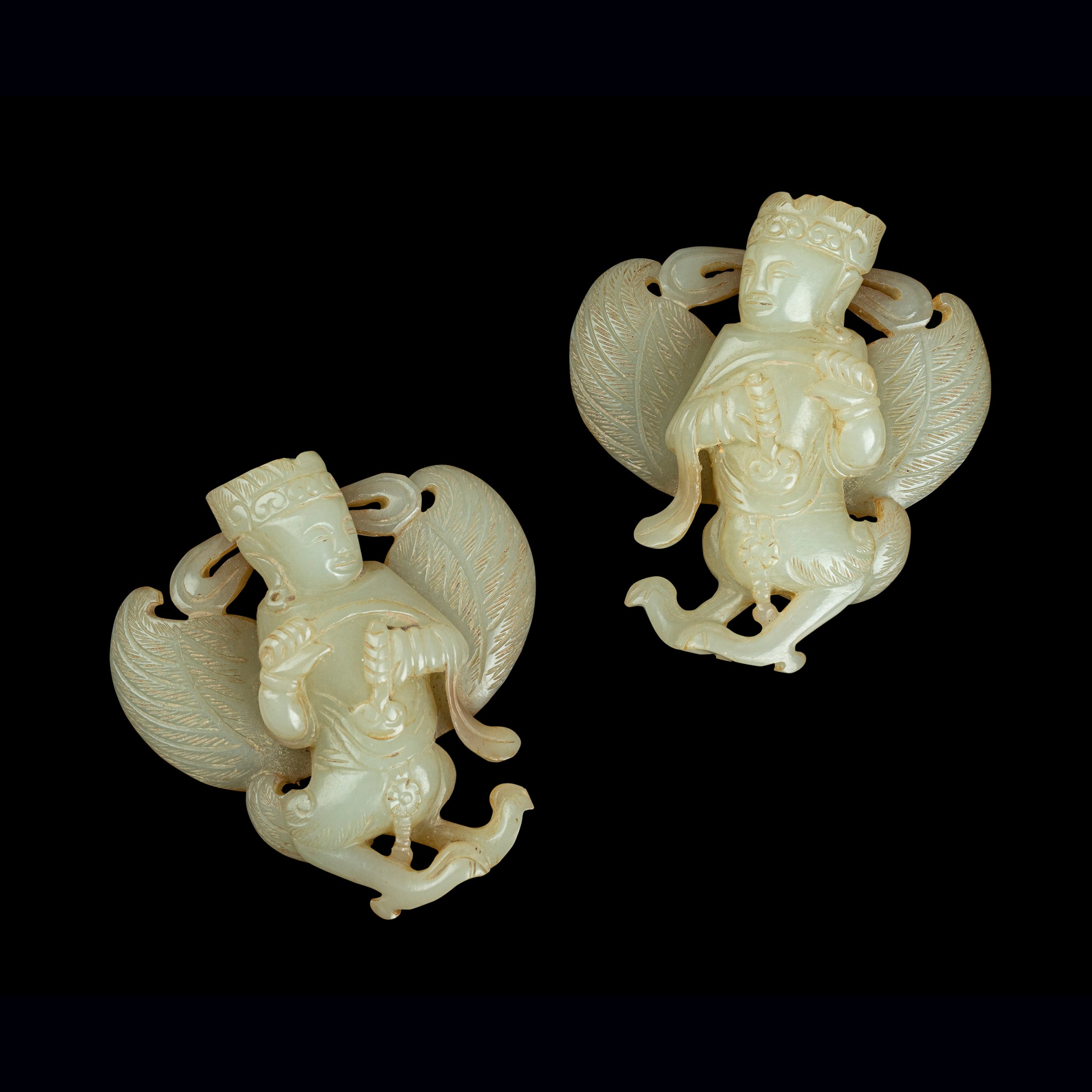 PAIR OF PALE CELADON JADE CARVINGS OF GARUDA