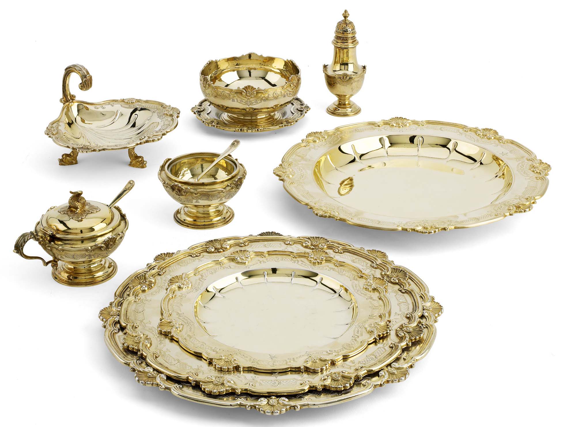 A large George V silver-gilt dinner service for twenty-four covers