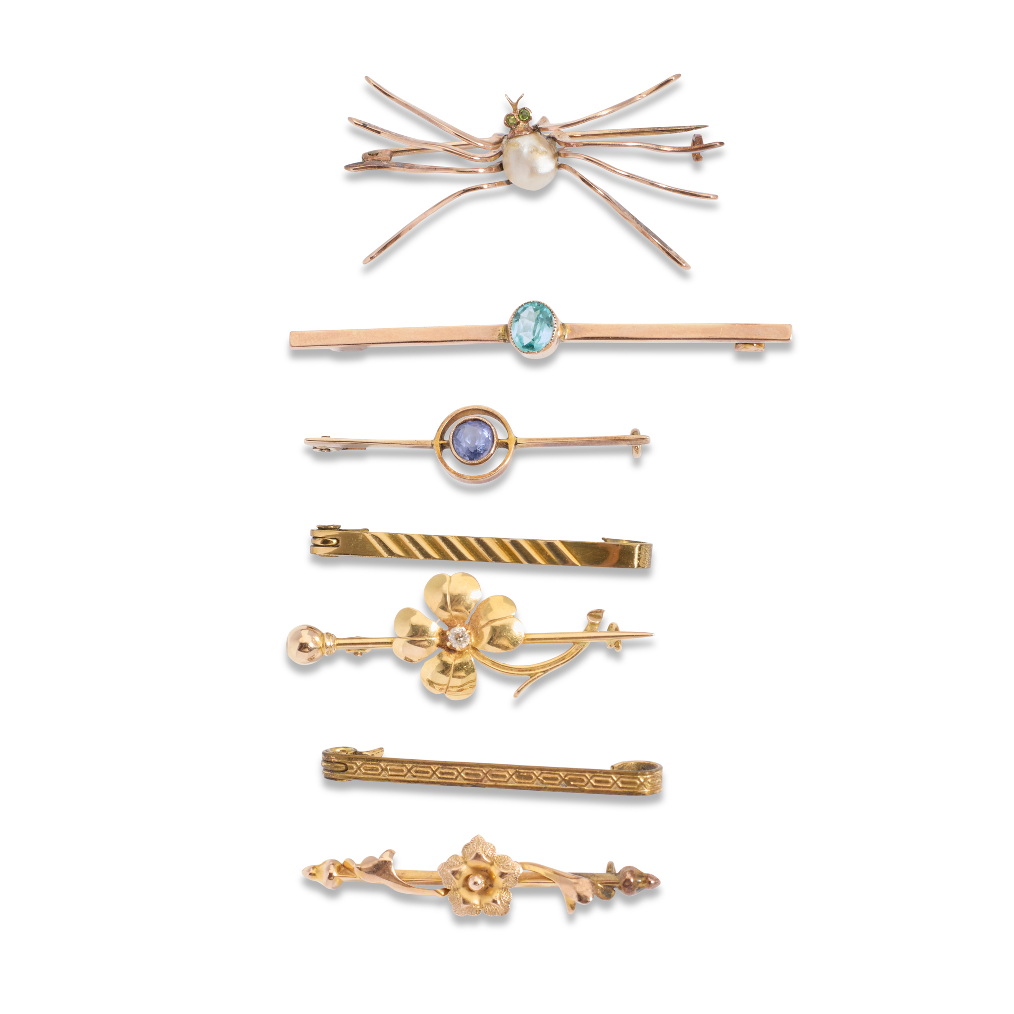 A collection of gem-set brooches