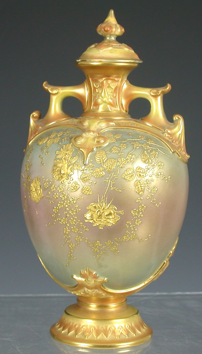 A Royal Worcester twin handled baluster vase and cover,