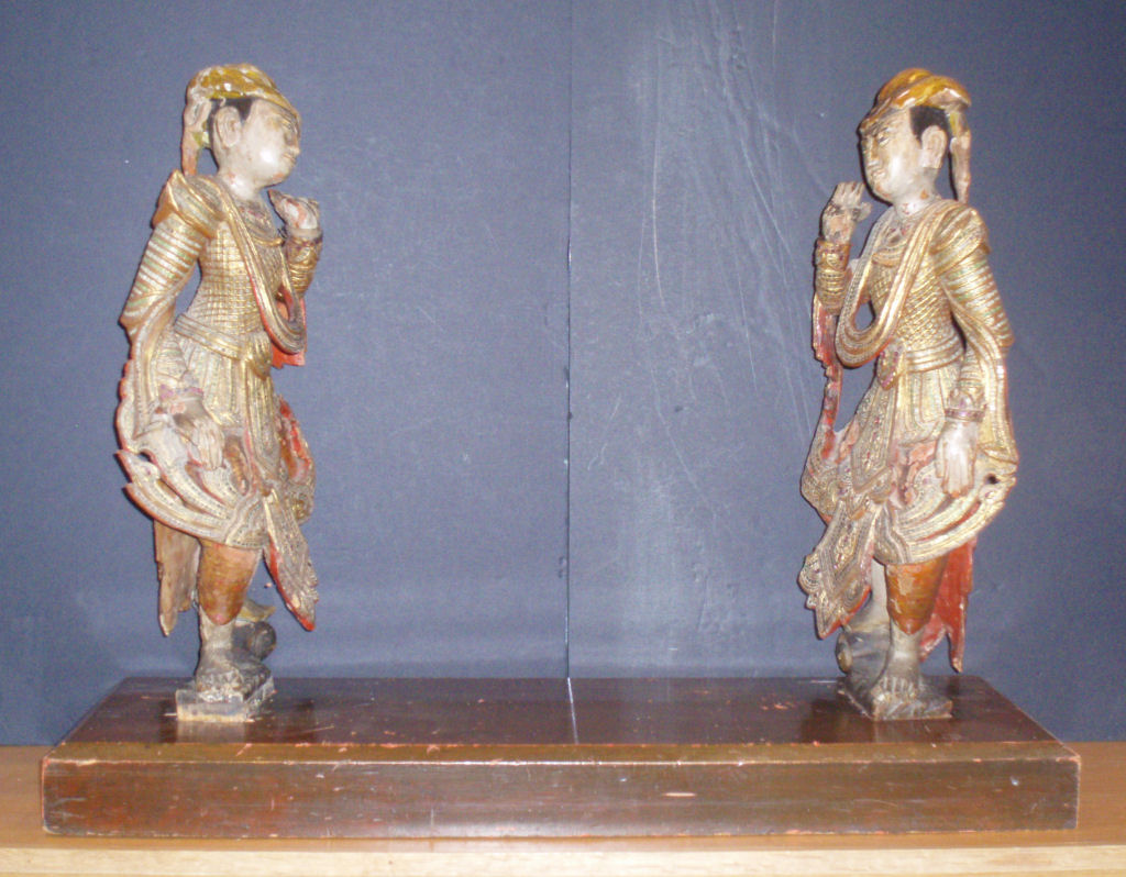 A pair of Burmese painted and carved wood figures Probably late 19th century