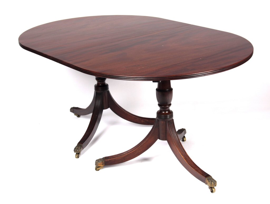 A Regency style mahogany pedestal dining table