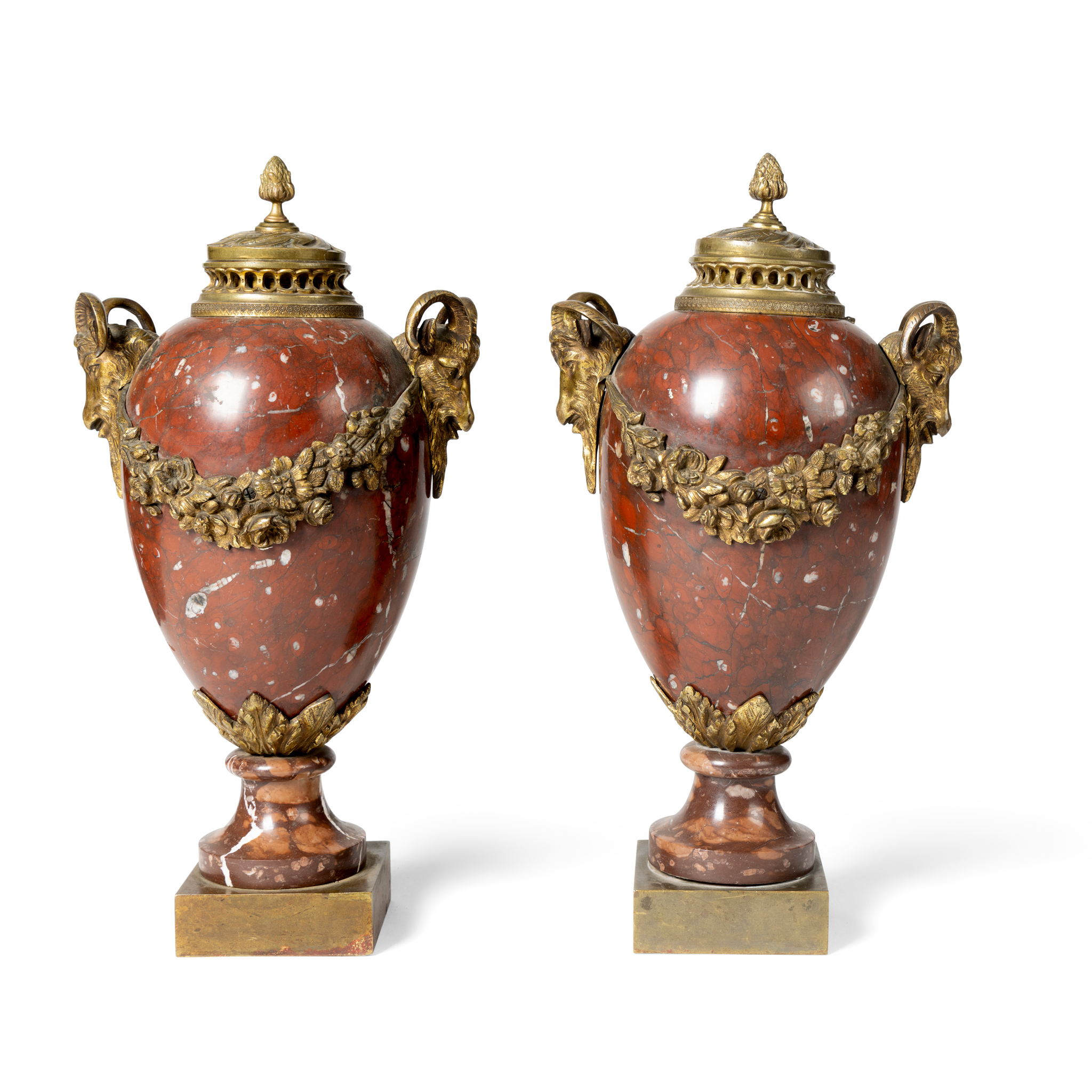 A PAIR OF RED MARBLE URNS AND COVERS, AND A PAIR OF PINK MARBLE URNS AND COVERS