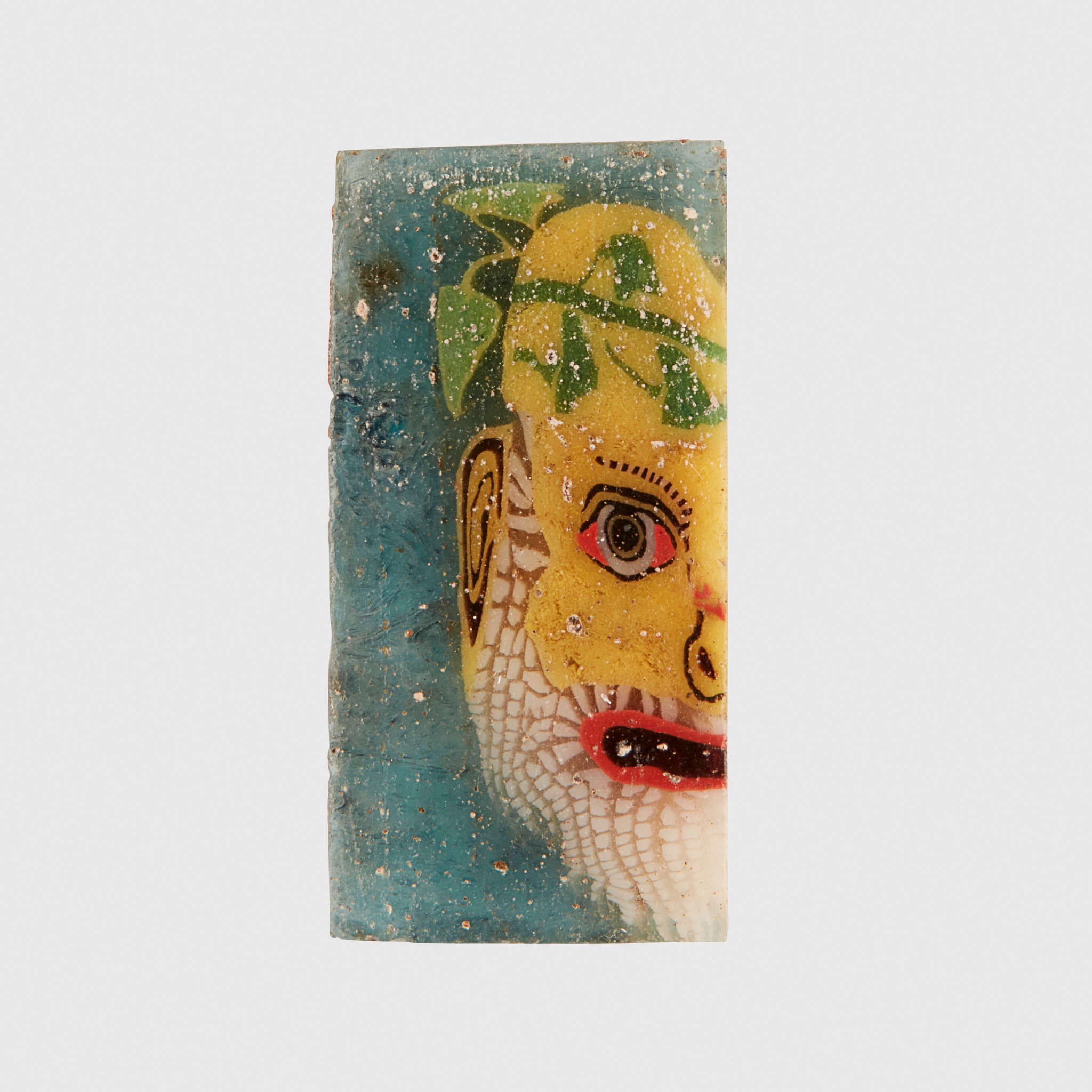 EGYPTIAN MOSAIC GLASS INLAY OF A COMIC ACTOR