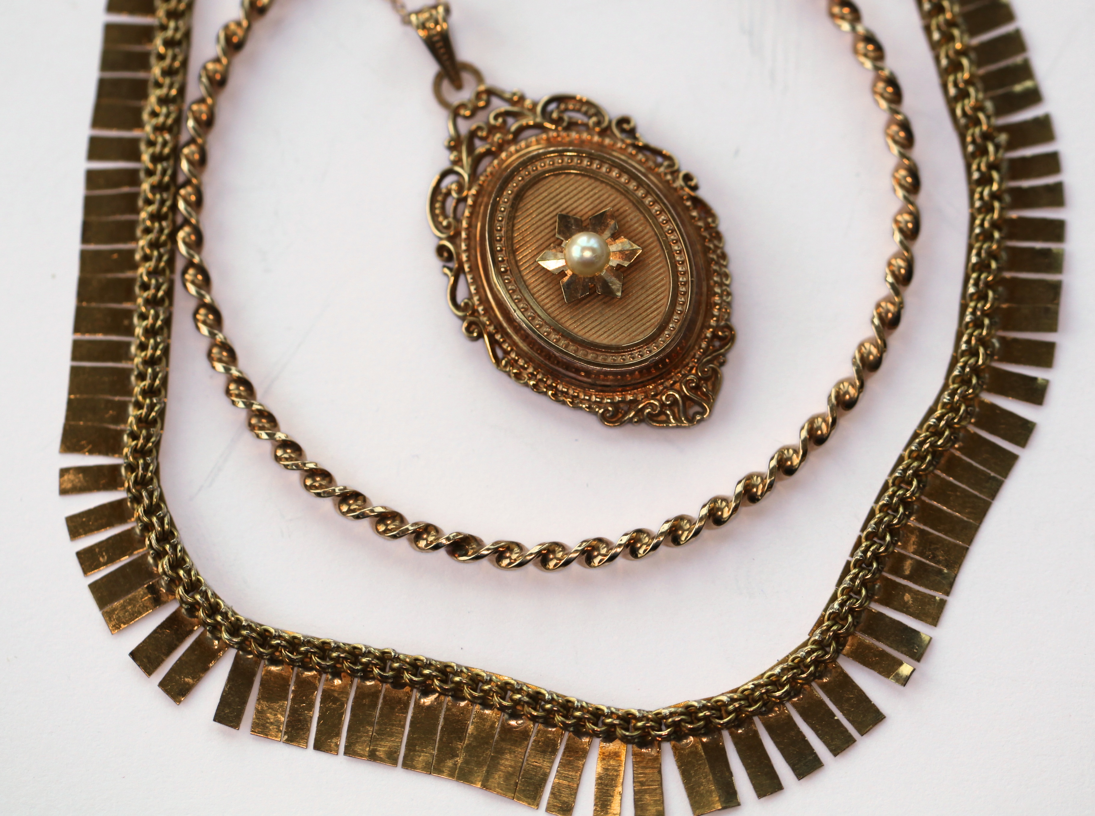 A locket with chain, bangle and necklace