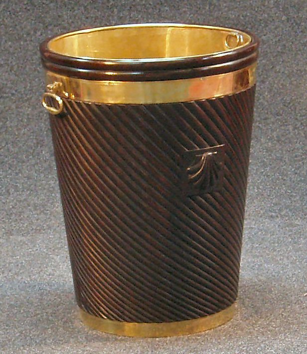 A large modern mahogany peat bucket,