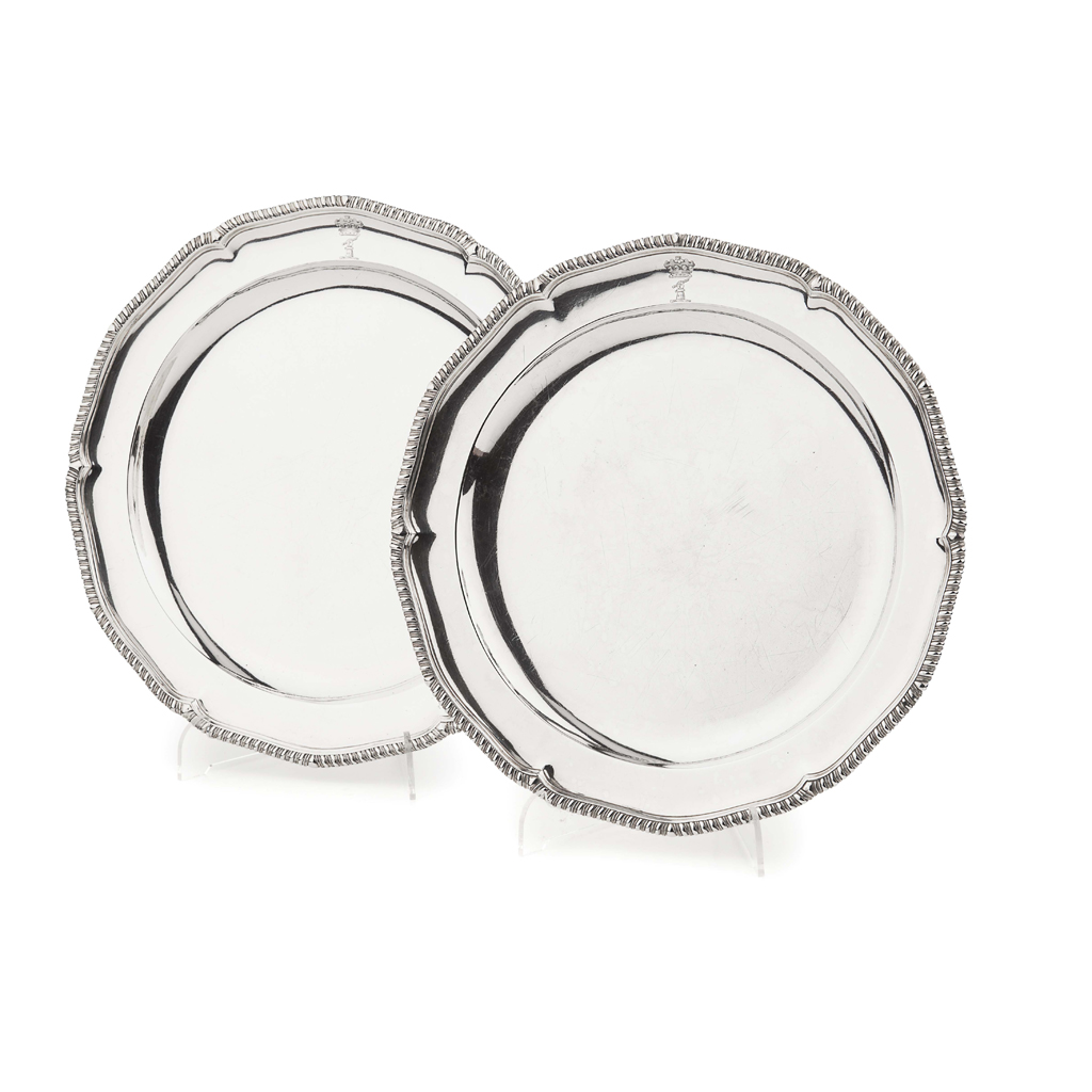 A pair of large George III silver meat dishes