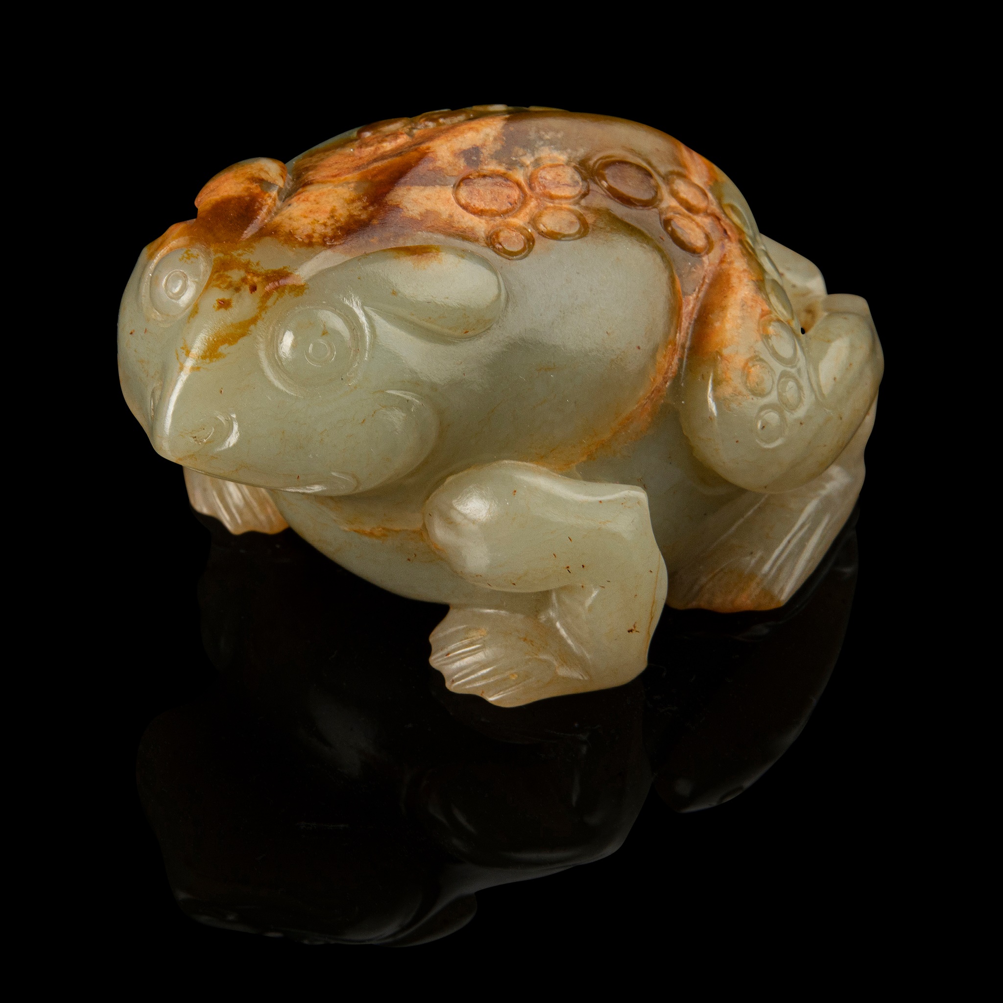 CELADON JADE WITH RUSSET SKIN CARVING OF A TOAD