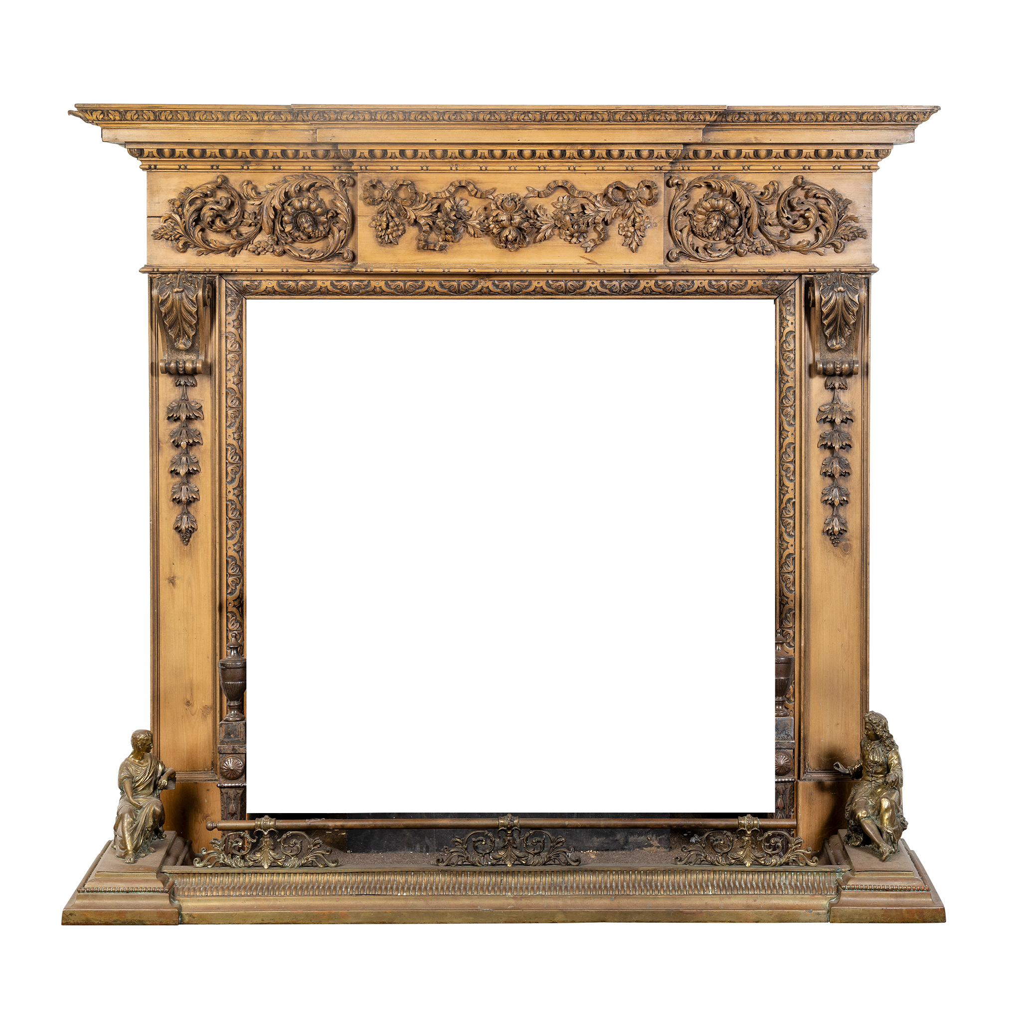 A CARVED PINE FIRE SURROUND