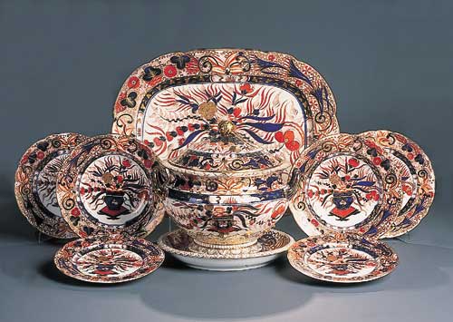 An English porcelain part dinner service painted in the Imari palette