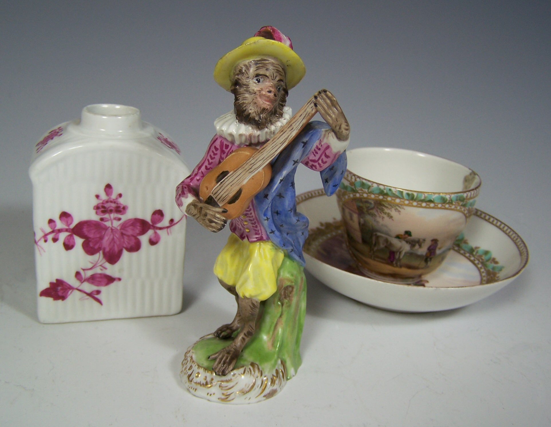A Meissen monkey playing the guitar