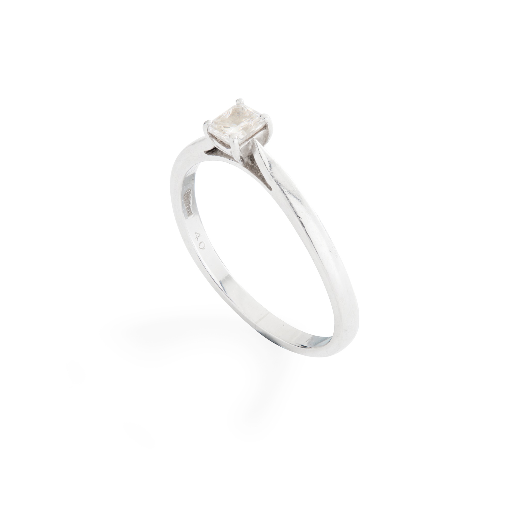 A diamond single-stone ring on plain band