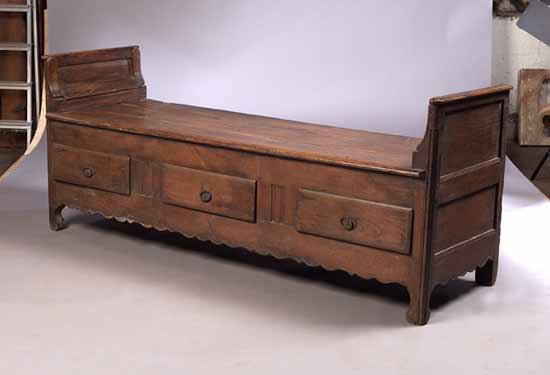An 18th century French provincial elm hall bench