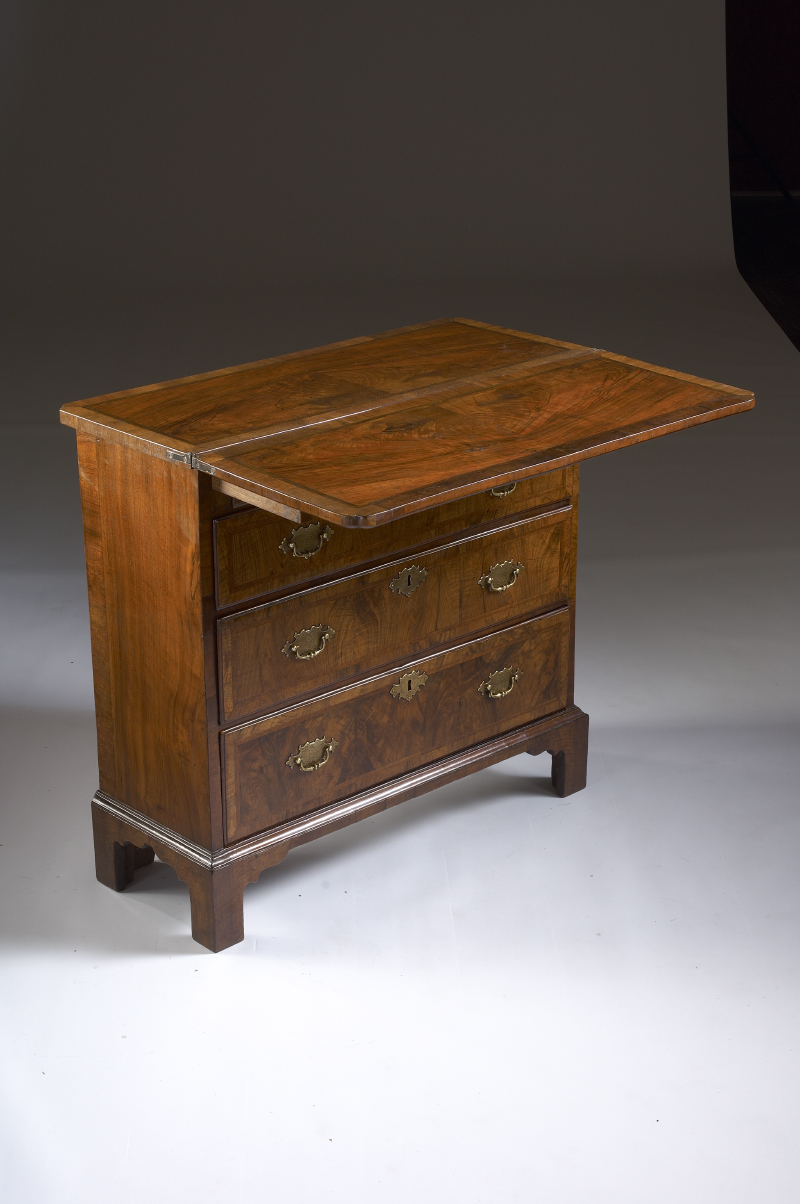 A George I period walnut and feather banded bachelor’s chest