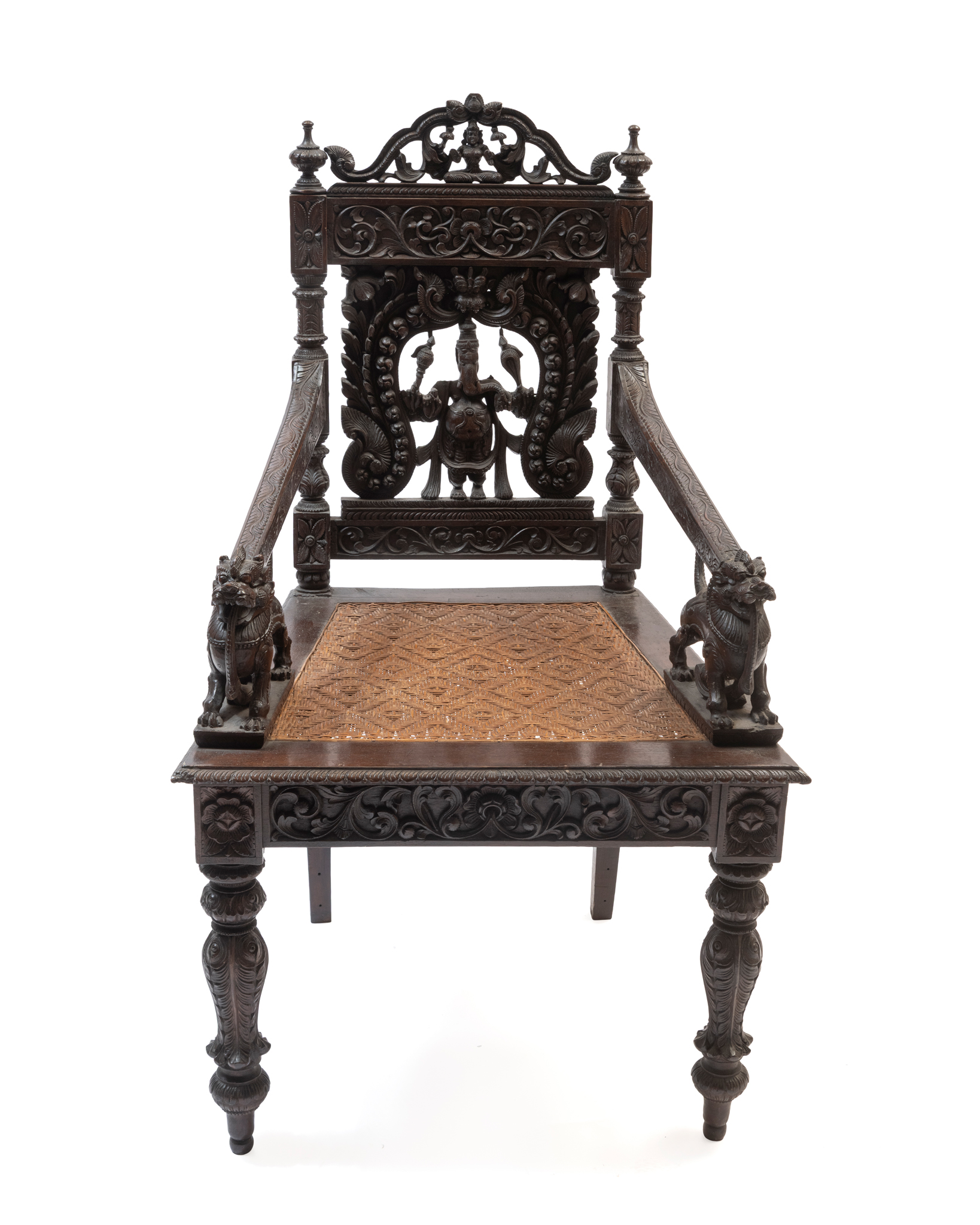 A RICHLY CARVED DARKWOOD ARMCHAIR