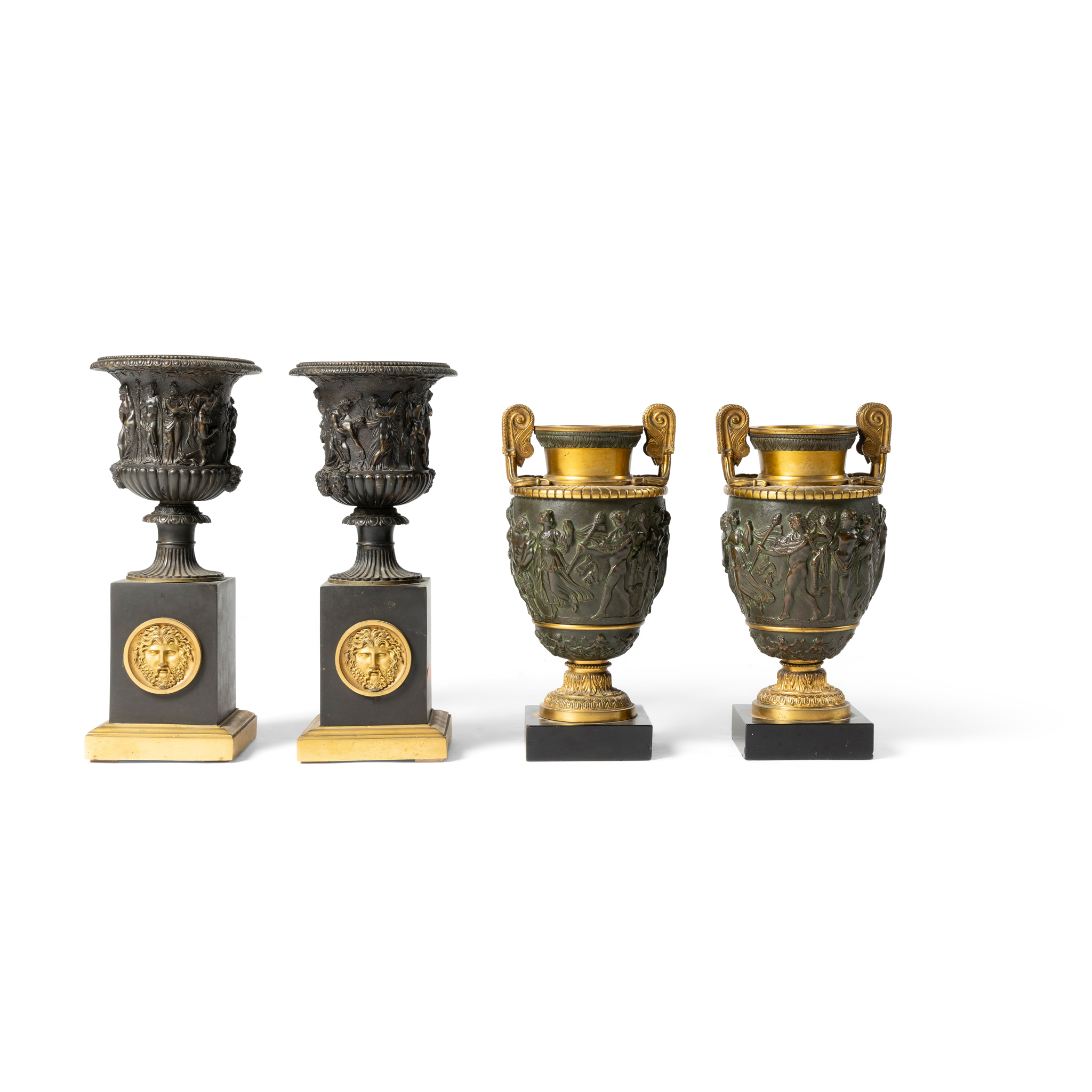 A PAIR OF BRONZE URNS ON PEDESTALS