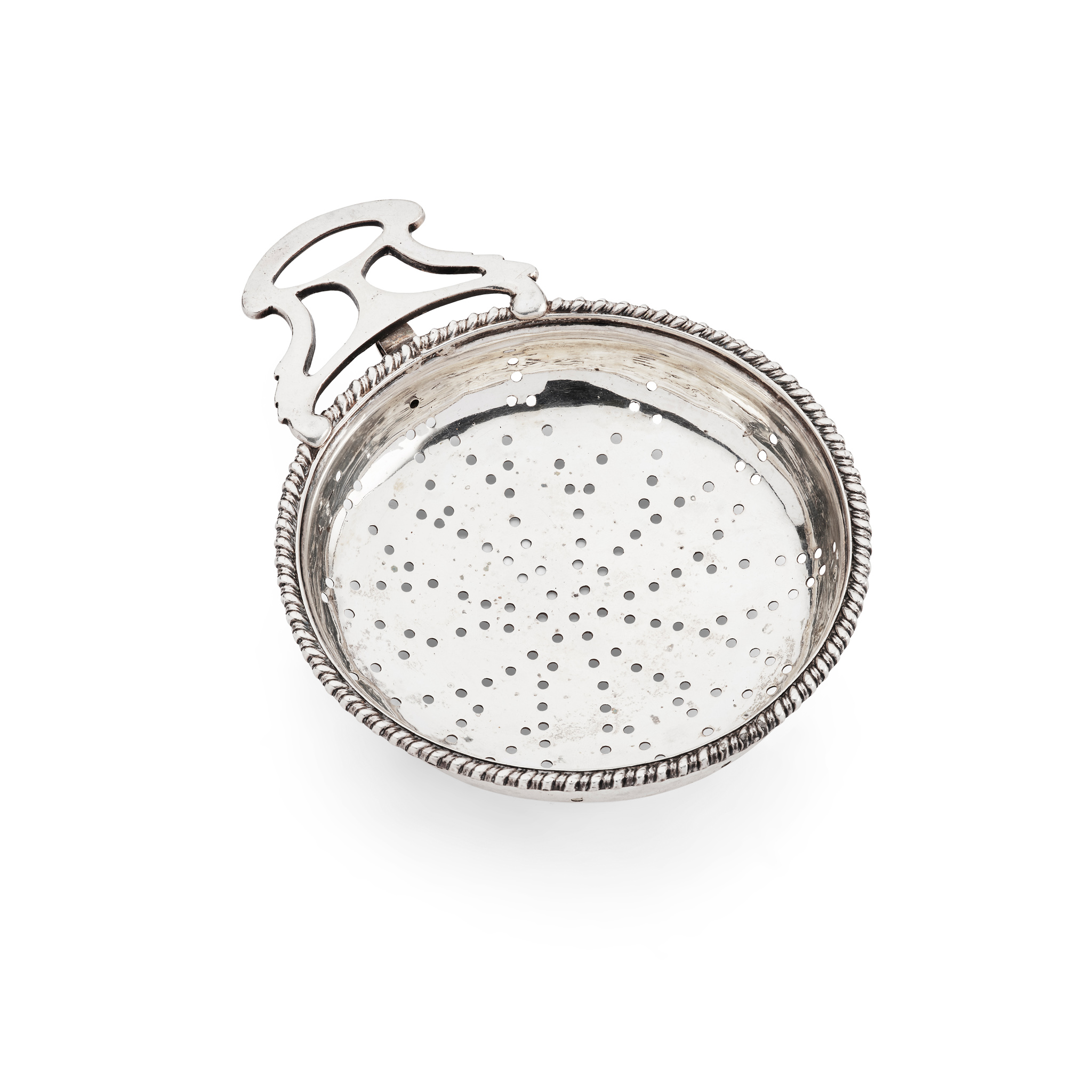 AN EARLY 19TH CENTURY SINGLE-HANDLED AMERICAN LEMON STRAINER