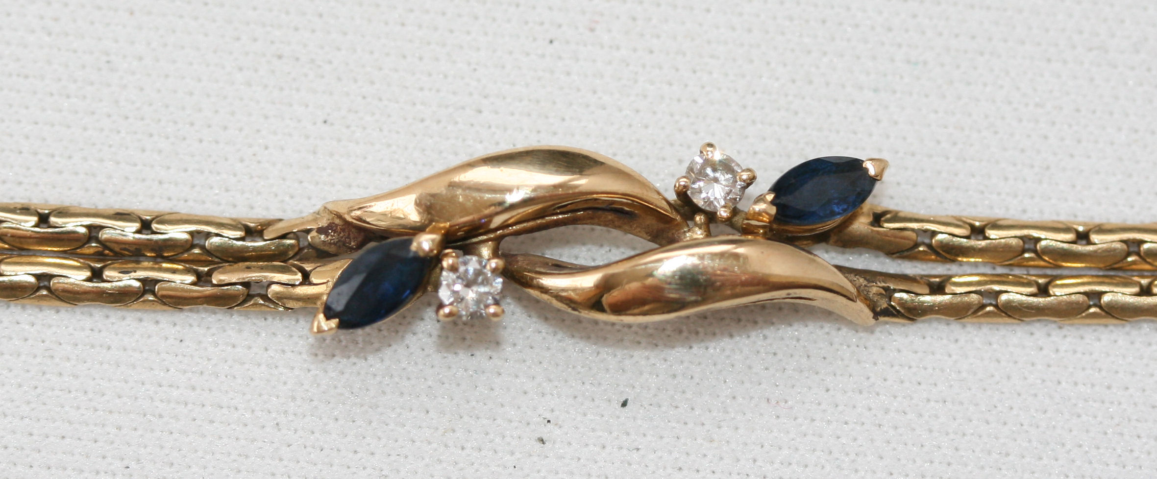 A sapphire and diamond suite of matched jewellery comprising