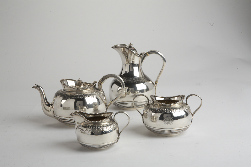 A composite late Victorian four piece silver tea service