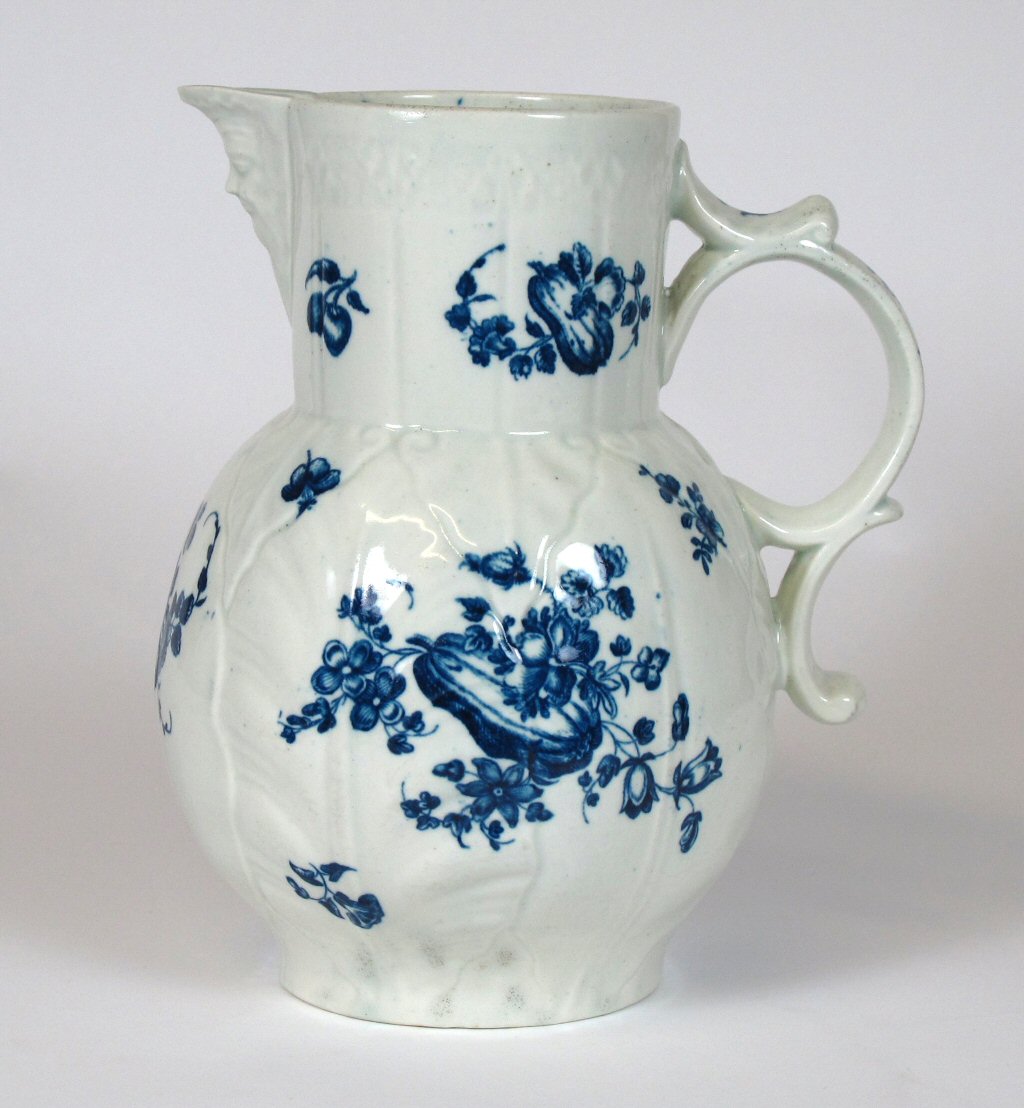 TWO WORCESTER BLUE AND WHITE MOULDED CABBAGE LEAF JUGS