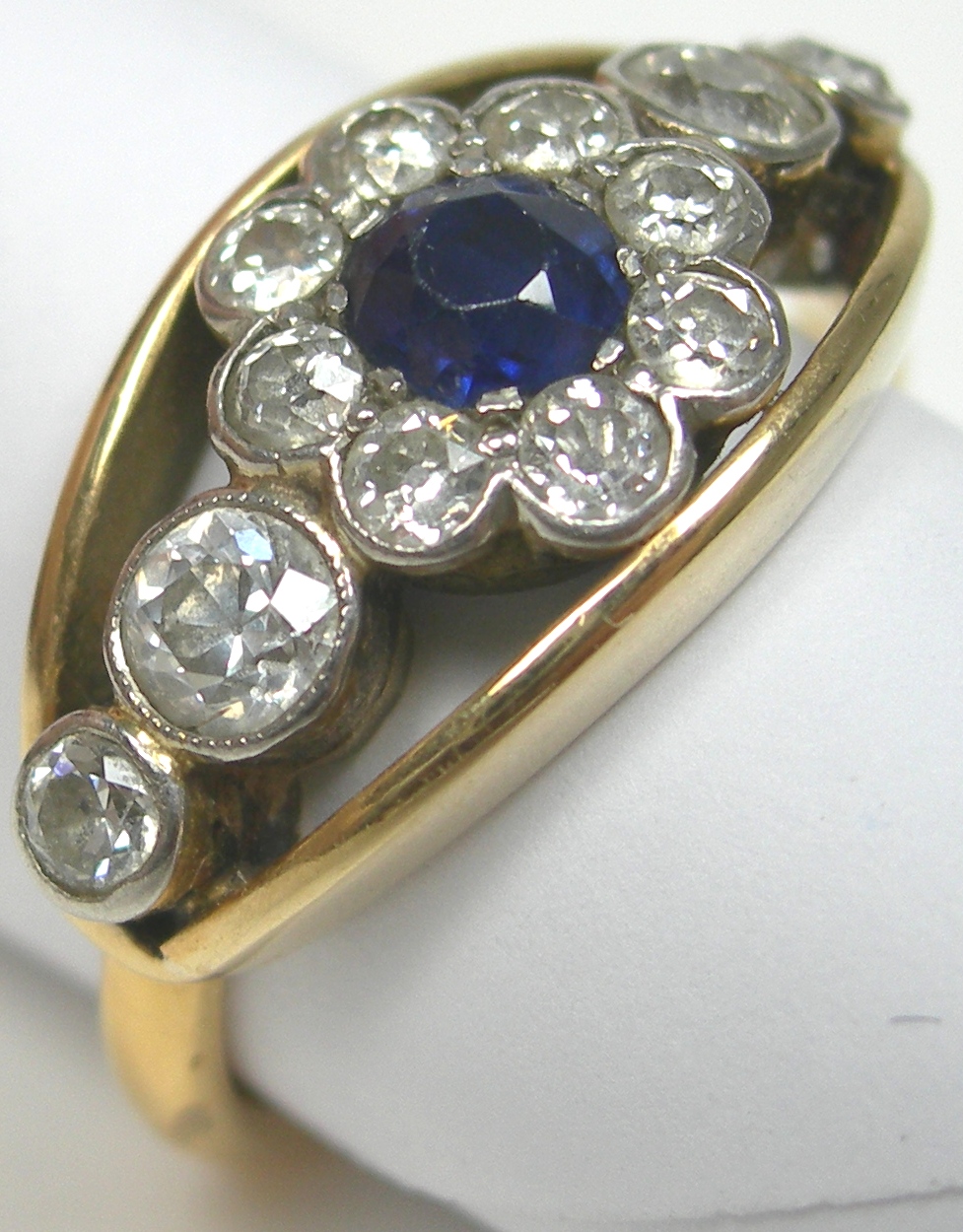 A 22ct gold mounted sapphire and diamond set cluster ring,