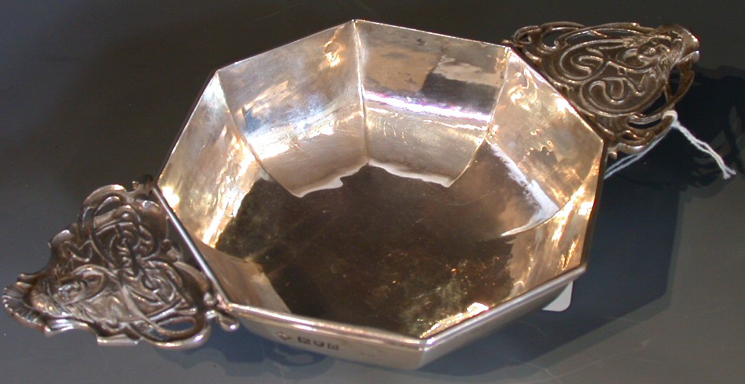 An Arts and Crafts style large octagonal quaich,