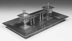 An Edwardian brass desk stand