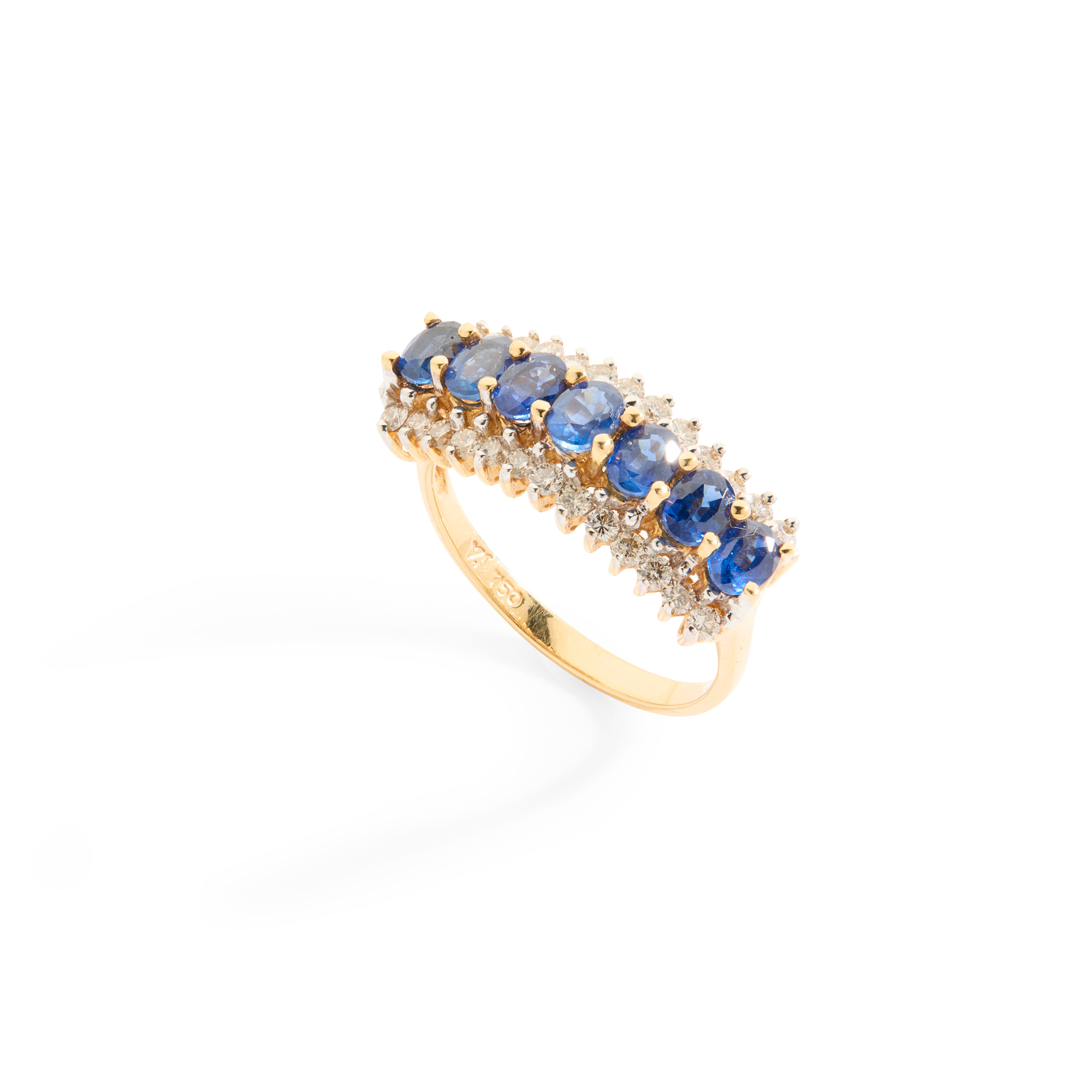 A sapphire and diamond dress ring and a 9ct gold emerald and diamond ring