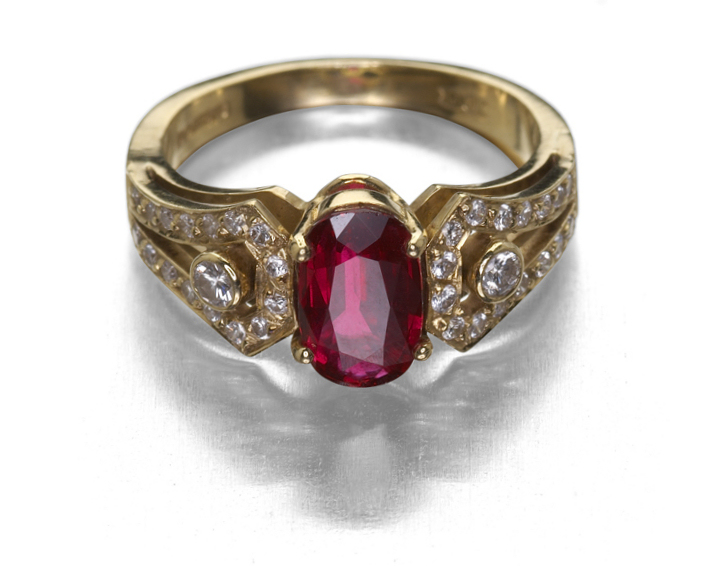 An 18ct gold mounted Art Deco style ruby and diamond set ring,