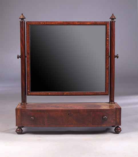 An early 19th century mahogany dressing mirror