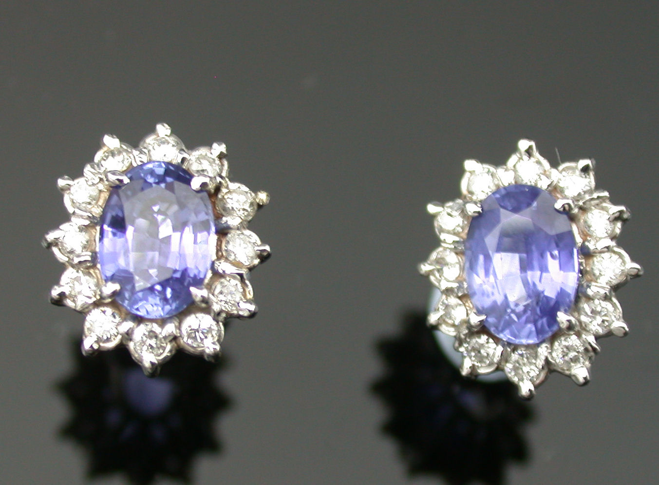 A pair of 18ct white gold mounted sapphire and diamond earrings,