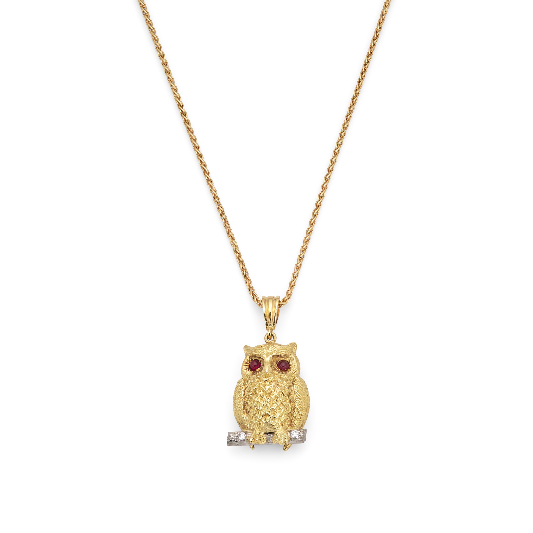 An 18ct yellow gold ruby and diamond owl pendant