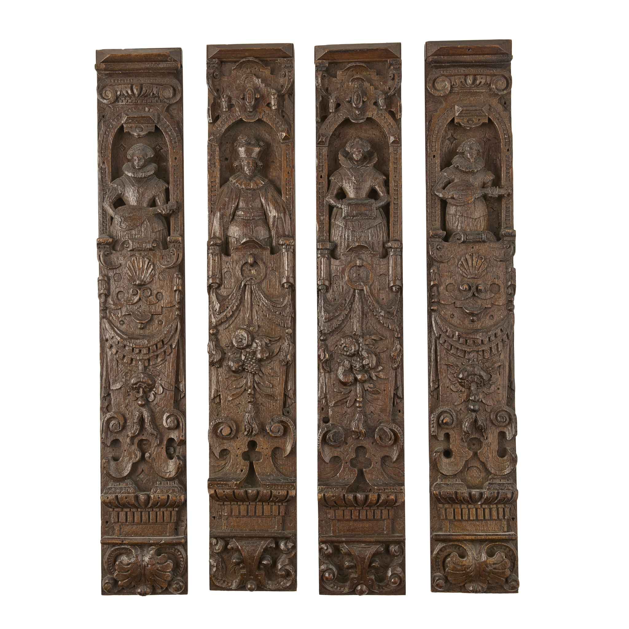 SET OF FOUR CARVED OAK FIGURAL PILASTERS
